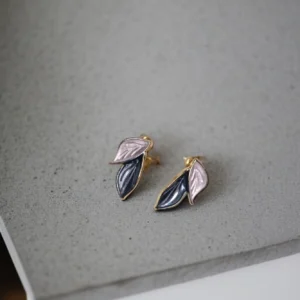 Gold dual-leaf enamel earrings with pastel pink and navy design – stylish artificial jewellery.