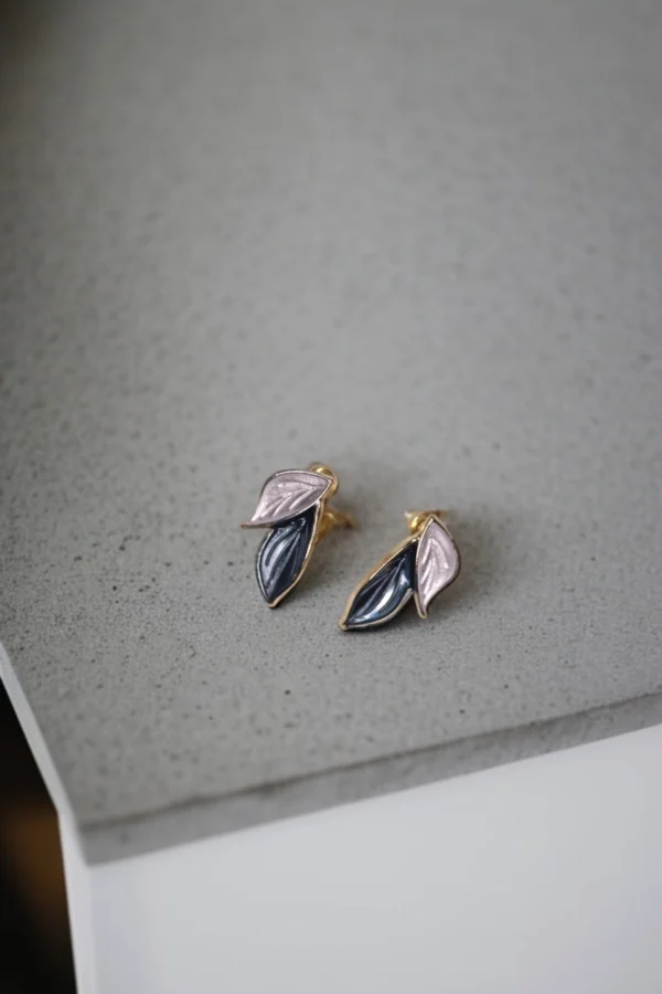Gold dual-leaf enamel earrings with pastel pink and navy design – stylish artificial jewellery.