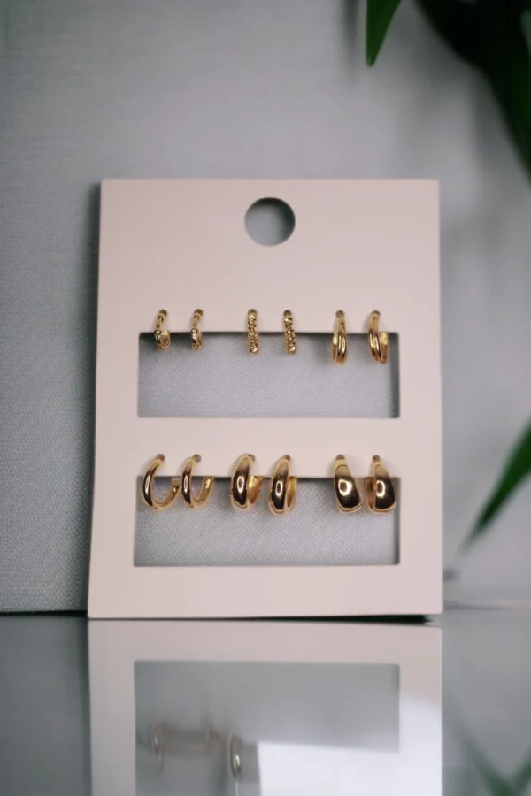 Set of 6 gold hoop earrings in polished and textured artificial jewellery design.