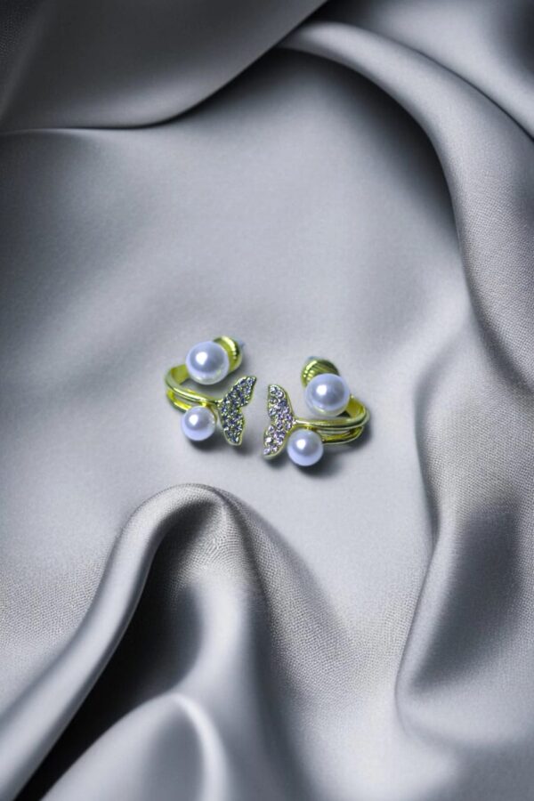 Artificial butterfly-shaped earrings with pearls and crystals – women’s Pakistani jewellery.