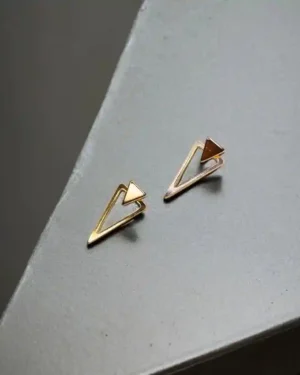 A close-up of a model wearing elegant diamond stud earrings design.