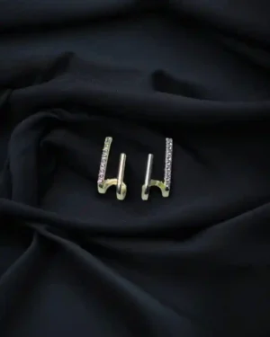 Elegant handcrafted gold jewellery displayed on white velvet background with intricate detailing – gold jewellery.