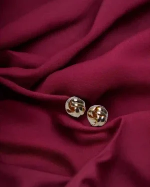 Close-up of traditional Pakistani jewellery set with colorful stones and intricate detailing