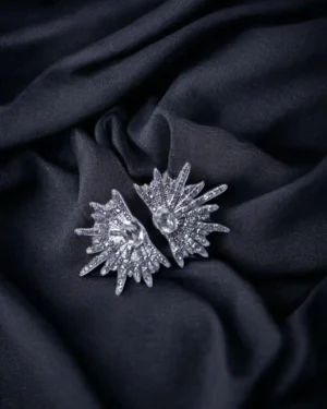 Elegant artificial jewellery set featuring gold-plated necklace and earrings on velvet background