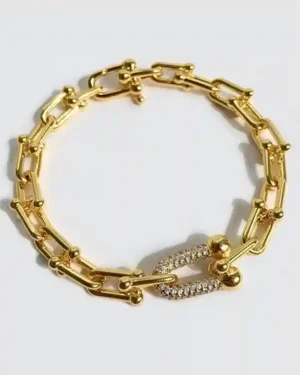 Bracelet designs in gold on a white background, featuring a yellow gold chain bracelet, a rose gold cuff, and a white gold tennis bracelet.