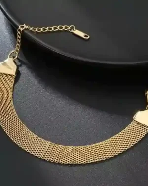 Bracelet in gold design on a white background, featuring a yellow gold chain bracelet, a rose gold cuff, and a white gold tennis bracelet.